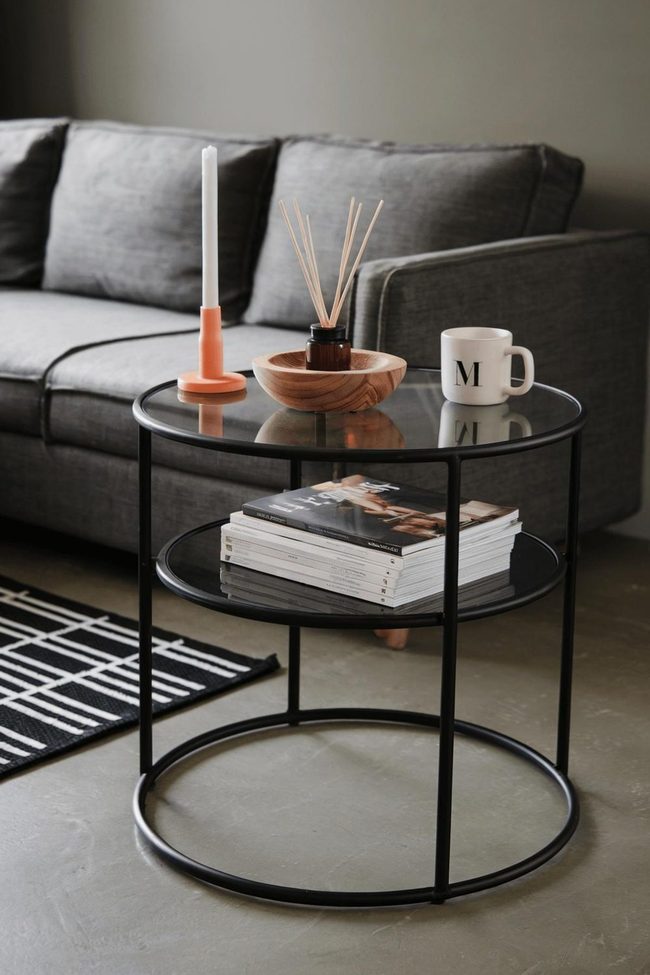 Black Glass Side Table With Orange Accent Candle