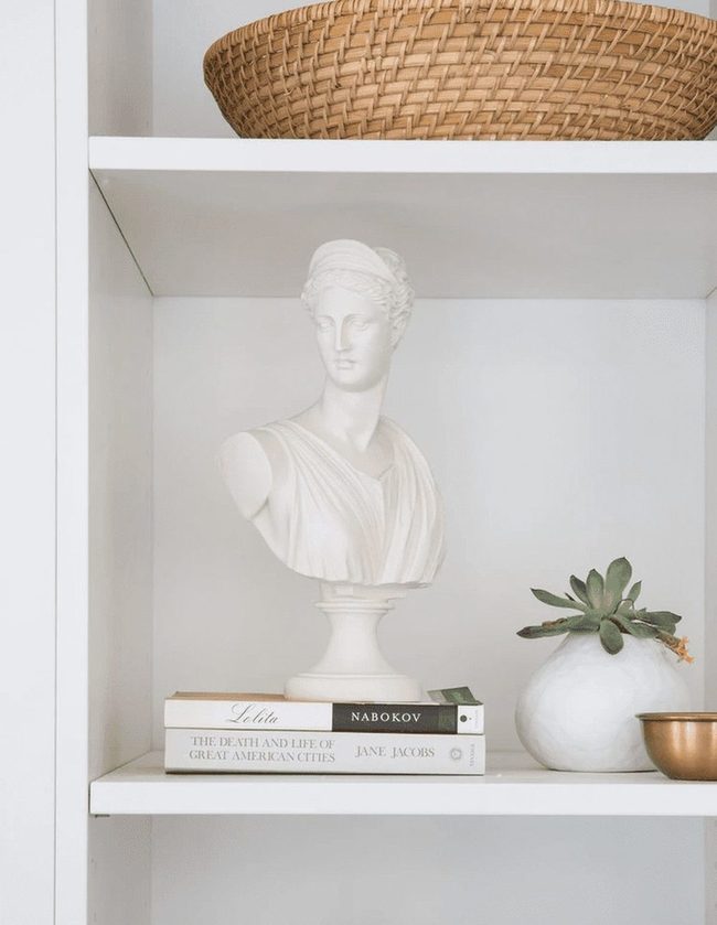 Classic Stone Statues On Shelves