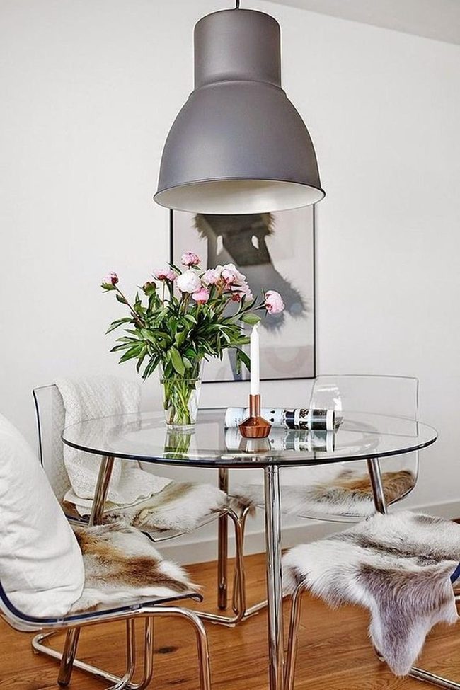 Glass Table With Fur-Topped Chairs