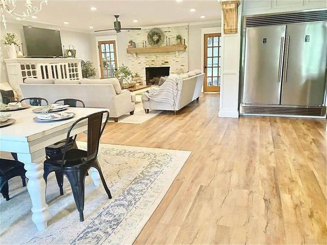Cream Couches Stone Fireplace Natural Light