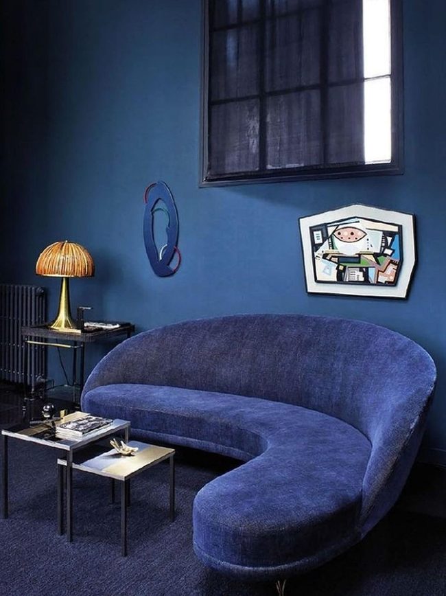 Deep Blue Walls With Golden Lamp Light
