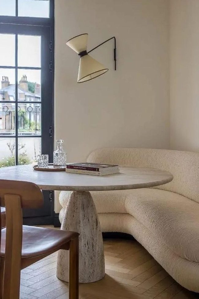 Round Stone Table With Cream Corner Seating
