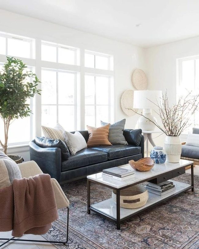 Sunlit Living Room With Dark Leather Sofa