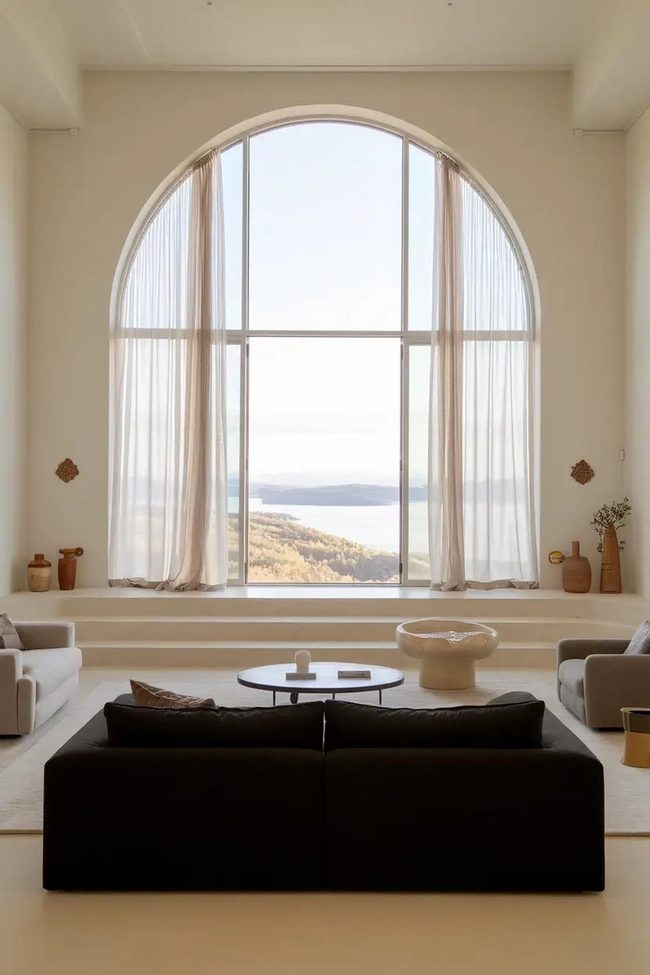 Black Couch Frames Panoramic Windows