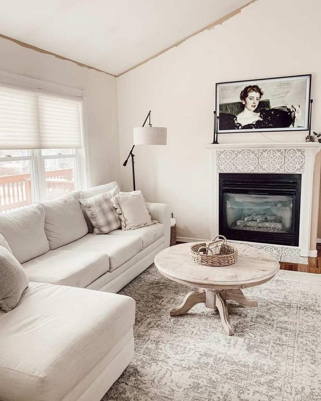 White Vaulted Lounge With Patterned Fireplace