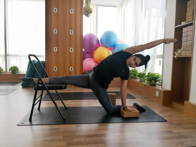 Chair-Assisted Hip Opening Stretch
