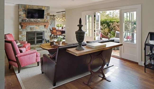 Pink Armchairs And Stone Fireplace
