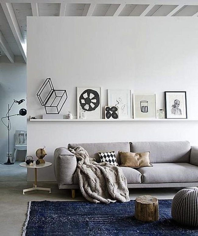 Gray Sofa White Walls Blue Rug
