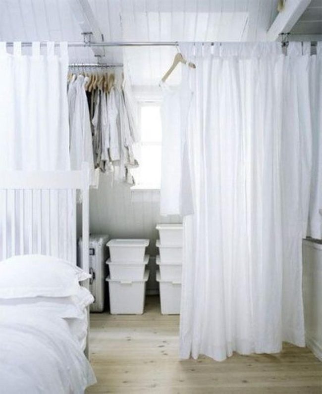 Fabric Panels Divide Airy Bedroom