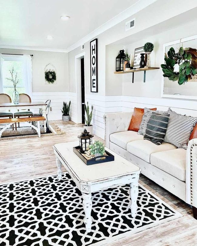 Black And White Rug Anchors Natural Living Room