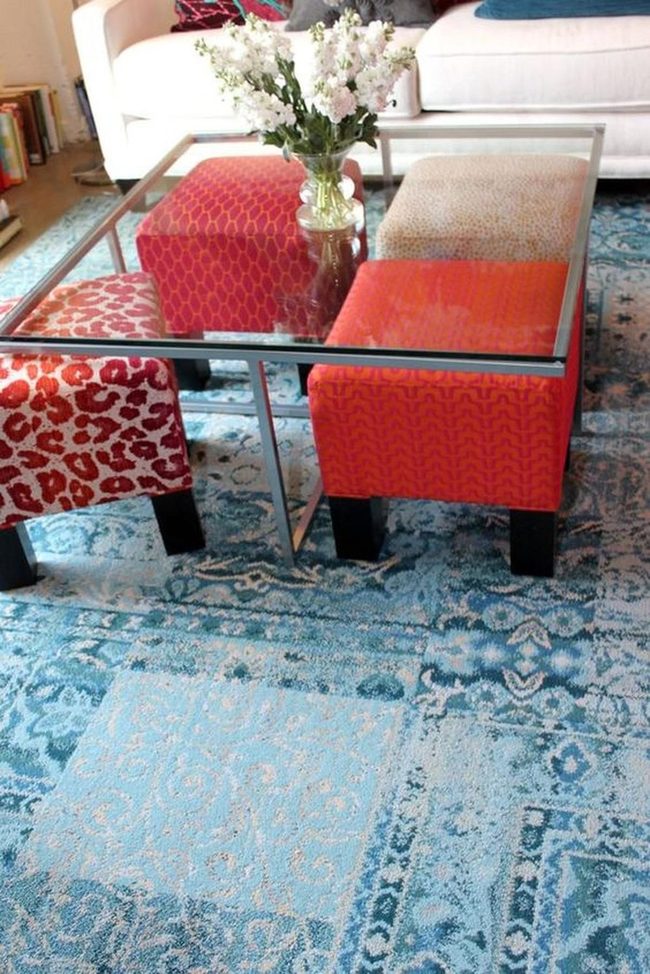 Red And Blue Ottomans With White Sofa