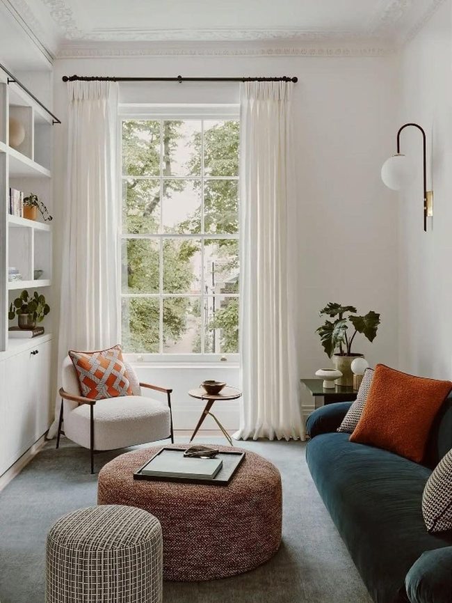 Blue Sofas Meet Warm Orange Accents