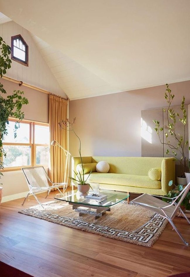 Green Sofa Anchors Light-Filled Room