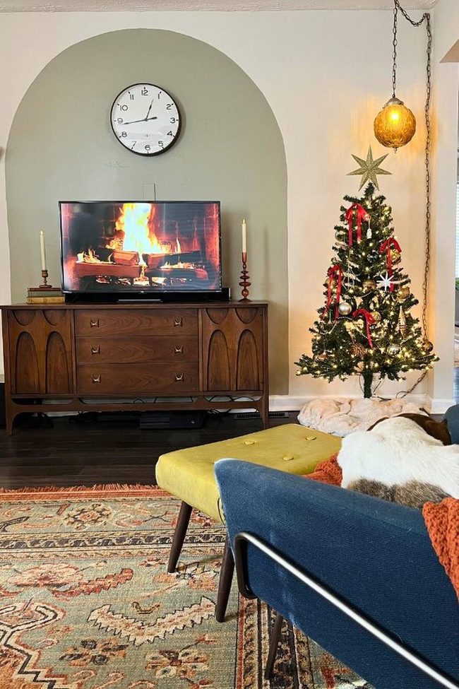 Exposed Brick Fireplace Meets Twinkling Tree