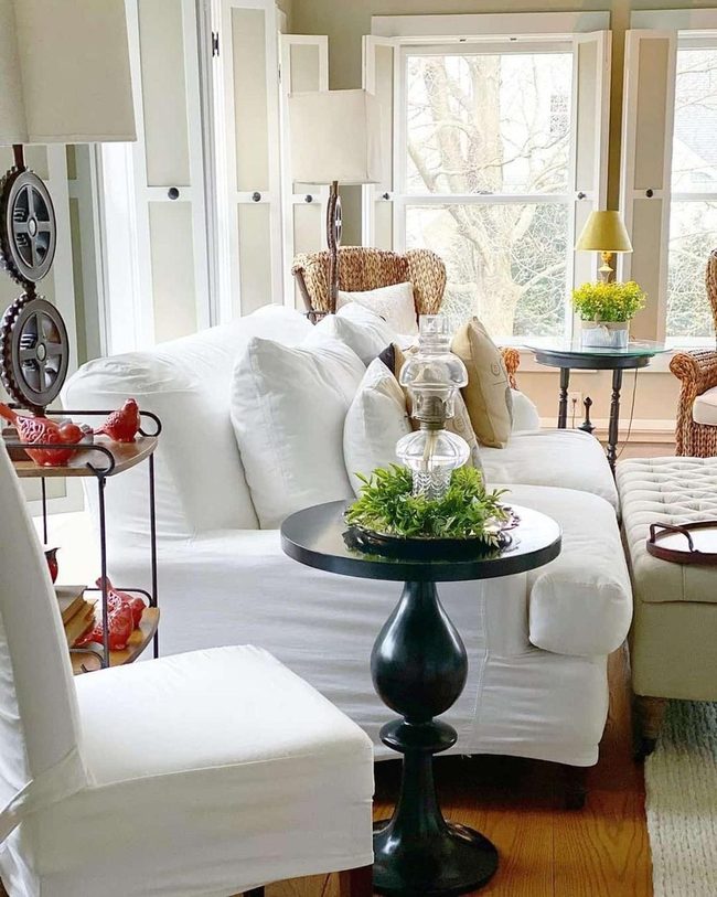 Black Round Table Anchors Neutral Room