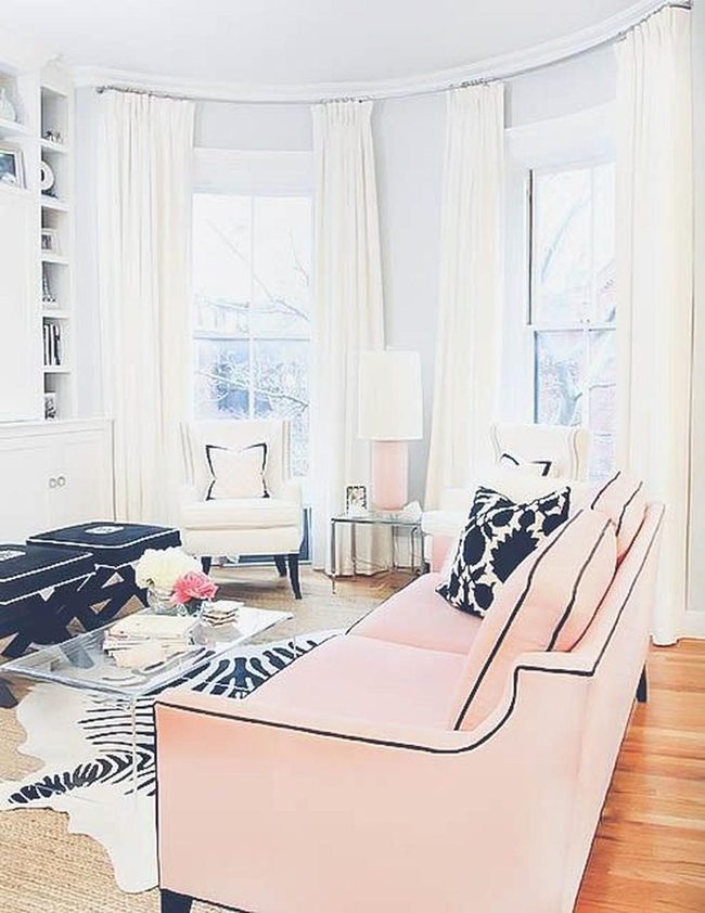 Pink Sofa Anchors Light-Filled Space
