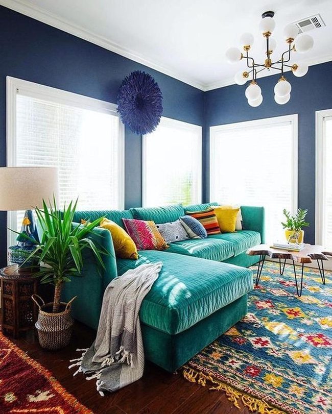 Teal Sectional With Jewel-Toned Walls