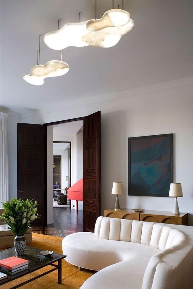 Dark Artwork Anchors Warm Neutral Room