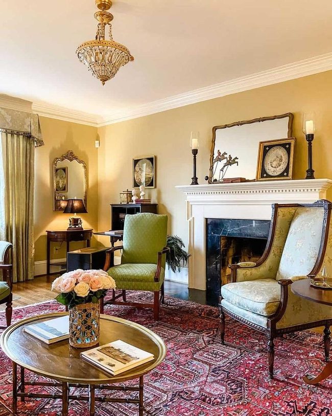 Gold Chandelier Above Crimson Vintage Rug
