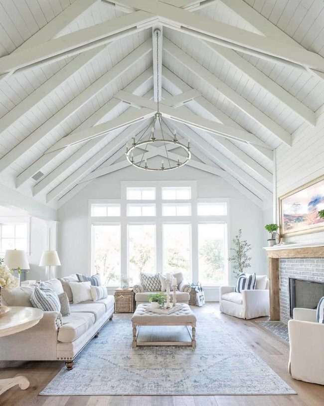 White Vaulted Ceilings With Wagon Wheel Charm