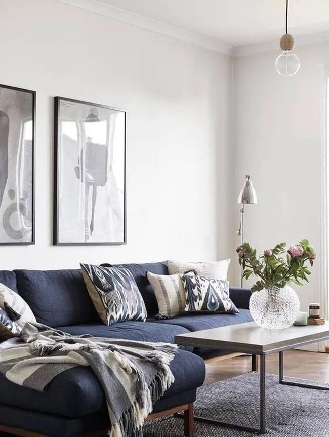 Dark Blue Sofa With Monochrome Art