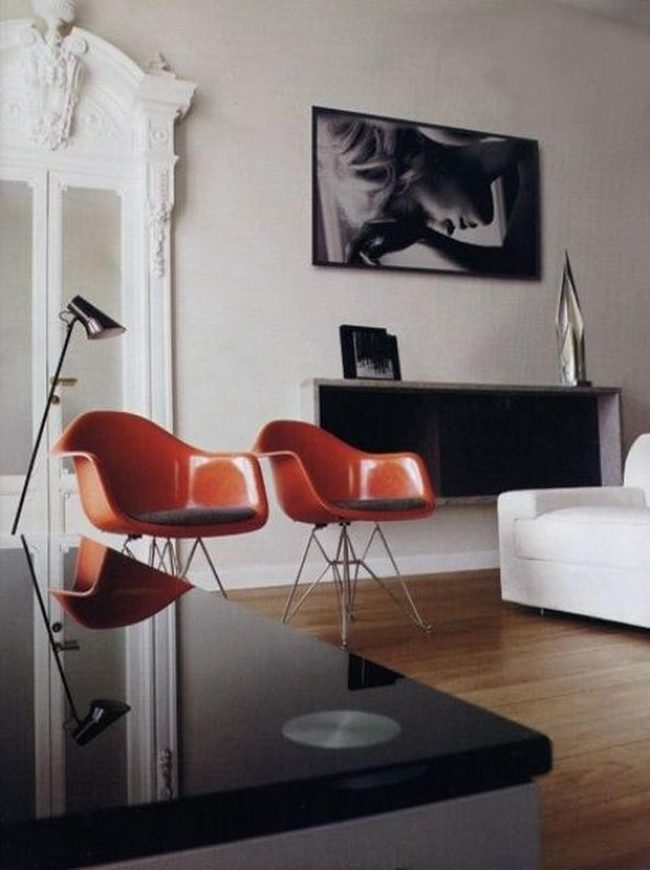 Orange Chairs Pop Against White Sofa