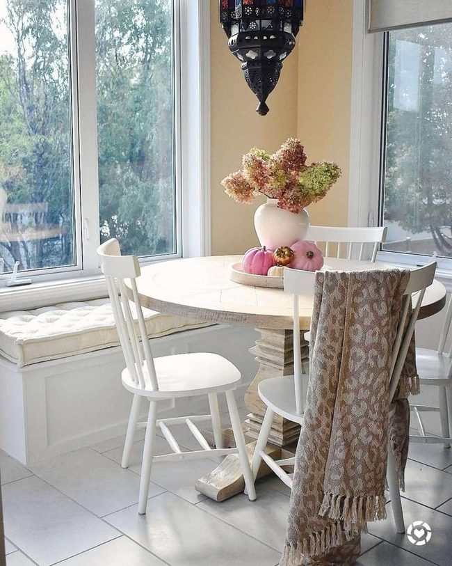 Sunlit Breakfast Nook With Pink Pumpkins