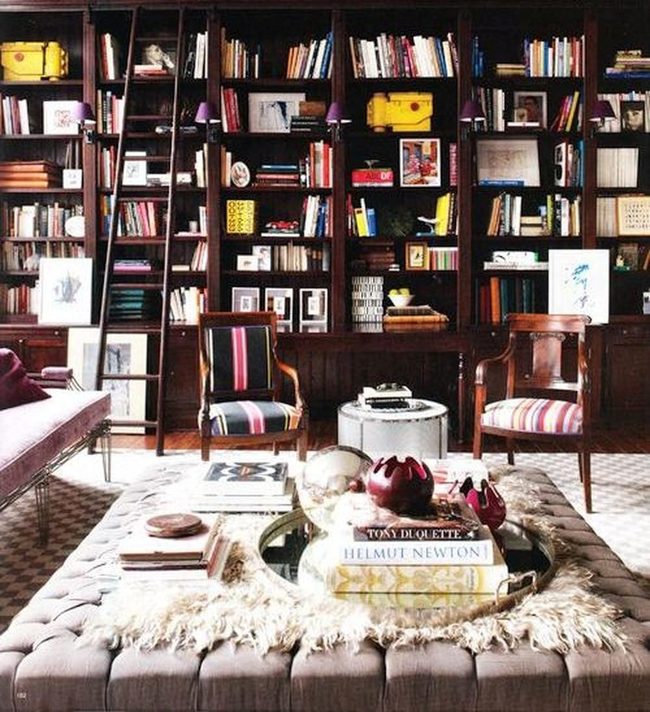Wooden Shelves Colorful Books Yellow Suitcases