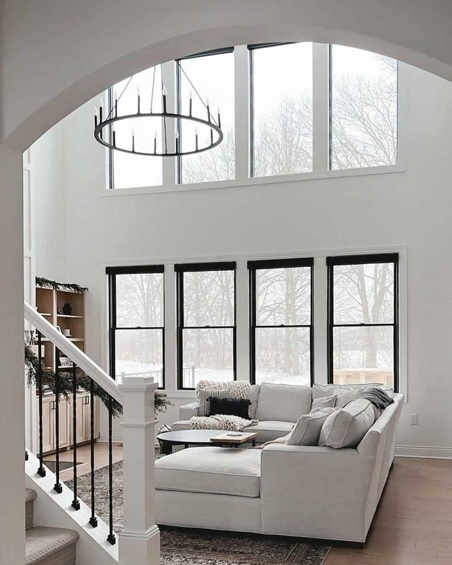 Dark Chandelier Transforms Bright Living Room