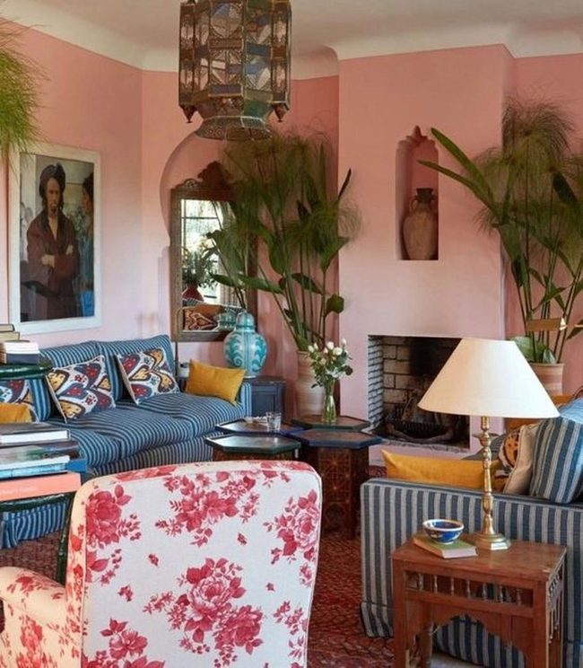 Pink Walls, Green Plants, Striped Sofas