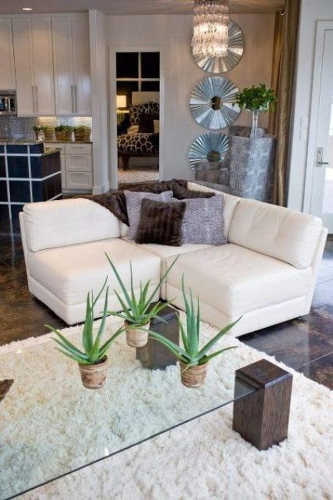 White Sectional With Mirrored Walls