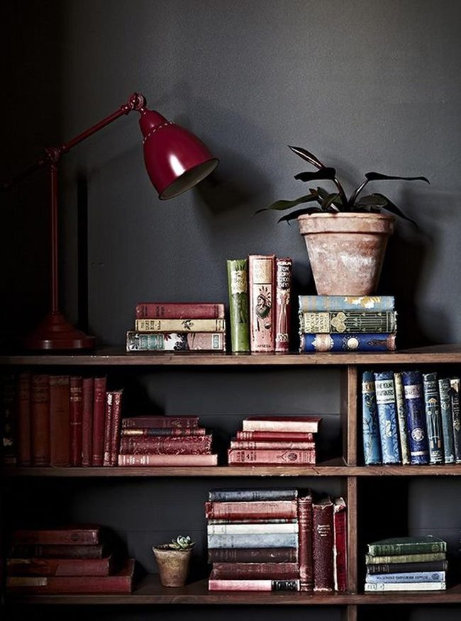 Weathered Books Against Dark Walls