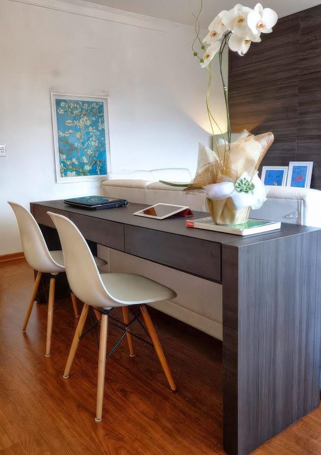 Dark Wood Table Anchors Minimal Space