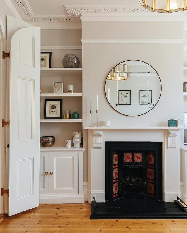 Round Mirror Above Fireplace