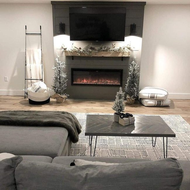 Gray Shiplap Fireplace With Evergreen Branches