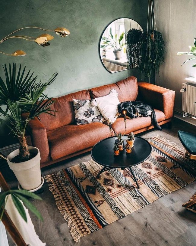 Brown Walls, Green Plants, Round Mirror
