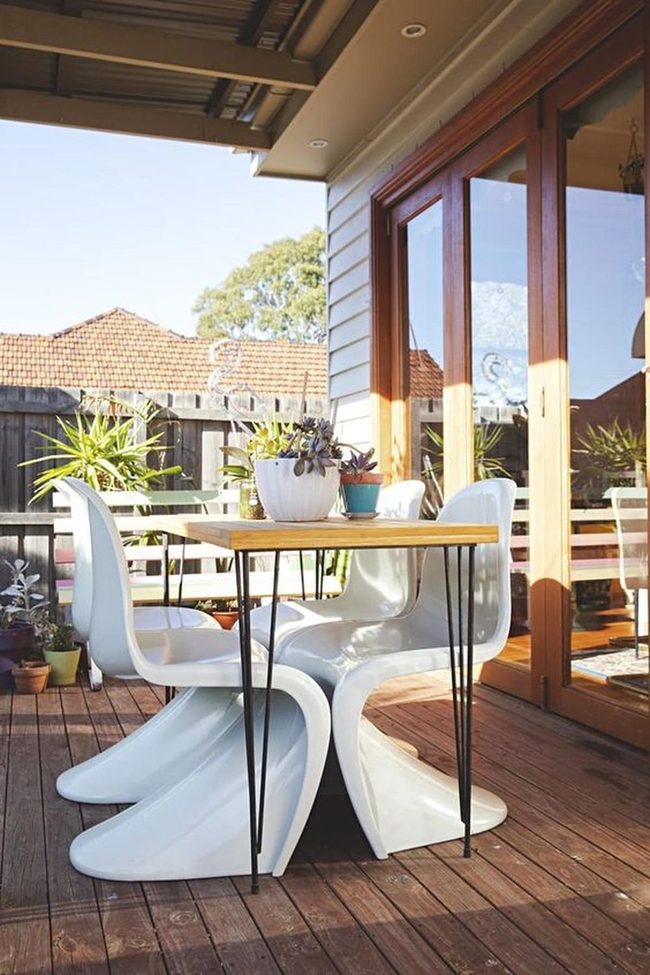 Light Wood Deck With White Chairs