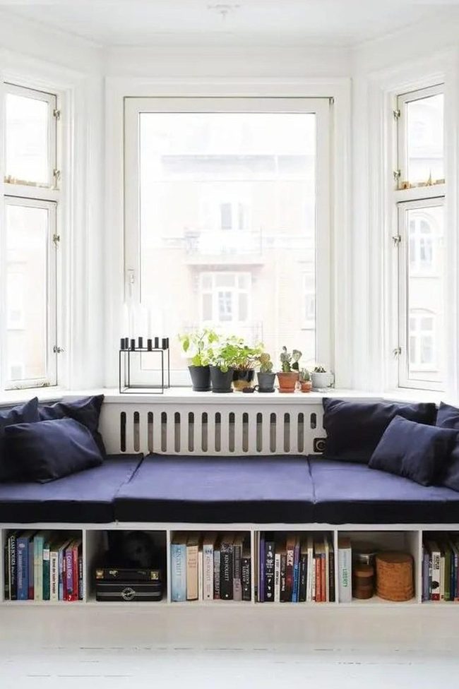 Blue Bench Under Bright Windows
