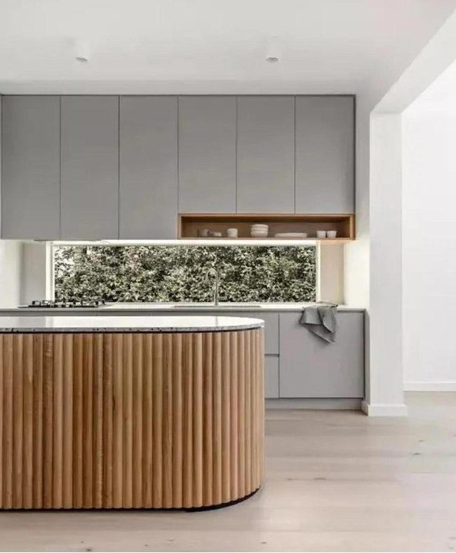 Gray Cabinets Meet Warm Wood Island