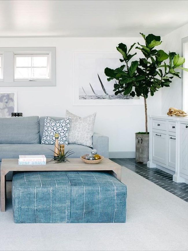 Gray Seating With Nautical Artwork Accents