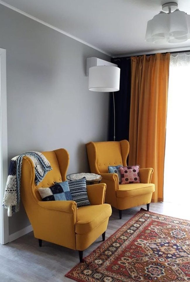 Yellow Armchairs, Orange Frames, Gray Walls