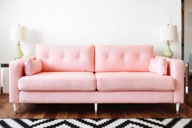 Pink Sofa With Geometric Rug Statement