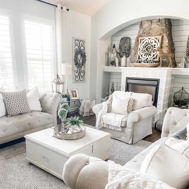 Stone Fireplace With White Tufted Seating