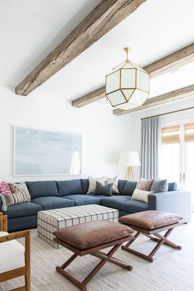 Blue Sectional With Wooden Ceiling Beams