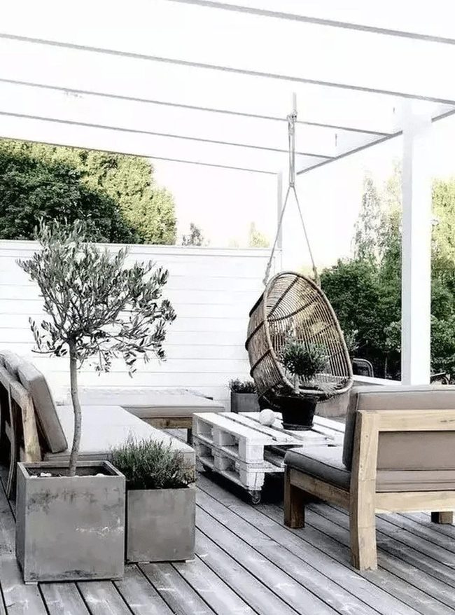 Light Wood Patio With Wicker Chairs