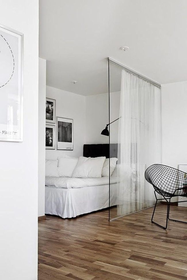 Black Chair Brightens Minimalist White Bedroom