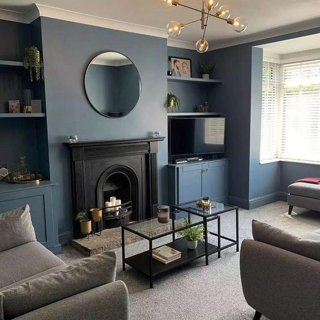 Bold Blue Walls With Dark Fireplace