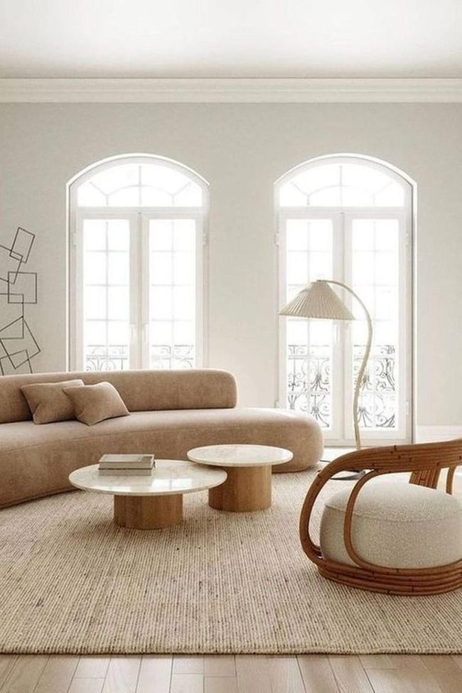 Curved Sofa Meets Sunlit Simplicity