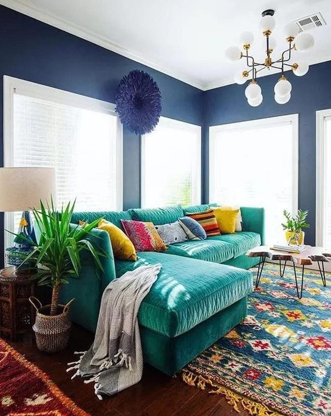 Teal Sofa Against Electric Blue Walls