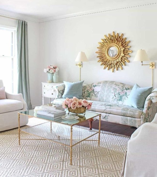 Golden Sun Mirror Above White Sofa